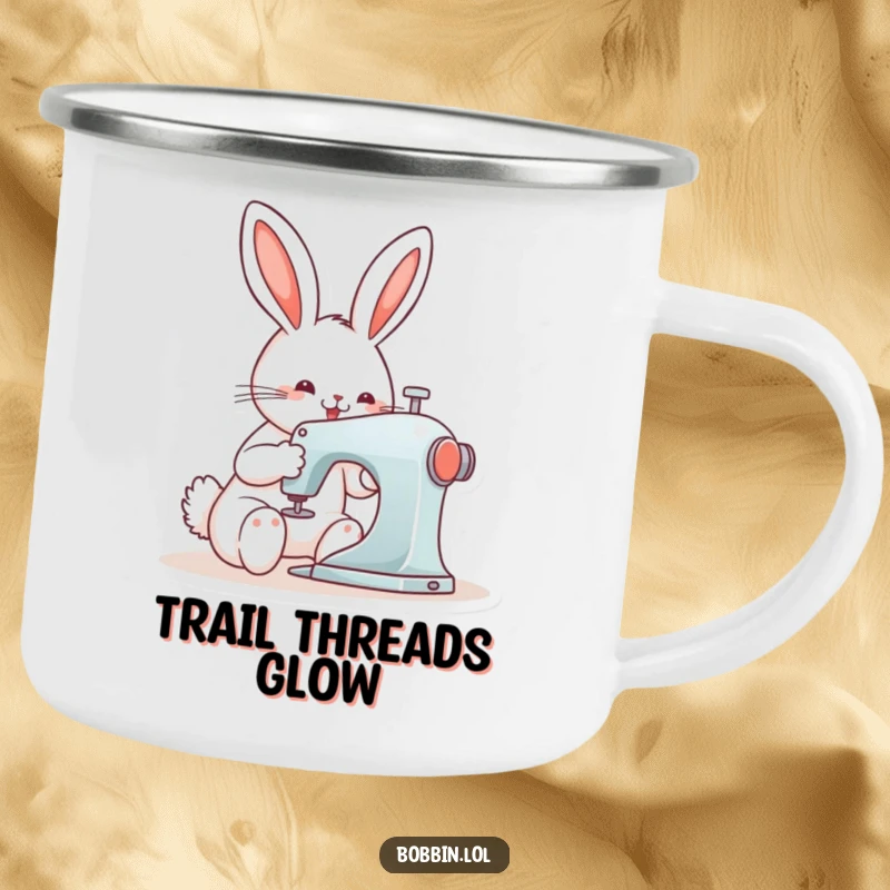 Funny bunny focused on sewing with a machine, depicted on a durable camping mug for outdoor adventures.