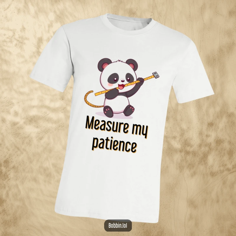 Funny Panda Sewing T-Shirt: A playful panda batting at a swinging measuring tape, very funny. Ideal funny gift.