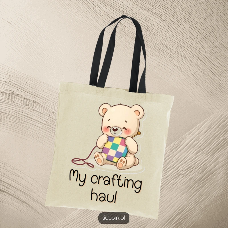 Funny tote bag with a tiny bear happily stitching a colorful quilt square, perfect for carrying craft supplies with joy.